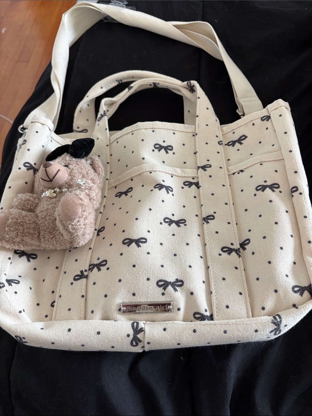 Madden girl. Cream Bow-Print Canvas Tote Bag with Bear Charm. - Picture 3 of 15
